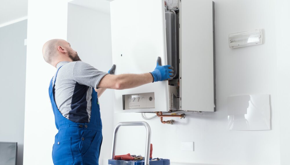 Professional boiler service at home Professional engineer doing a boiler inspection at home